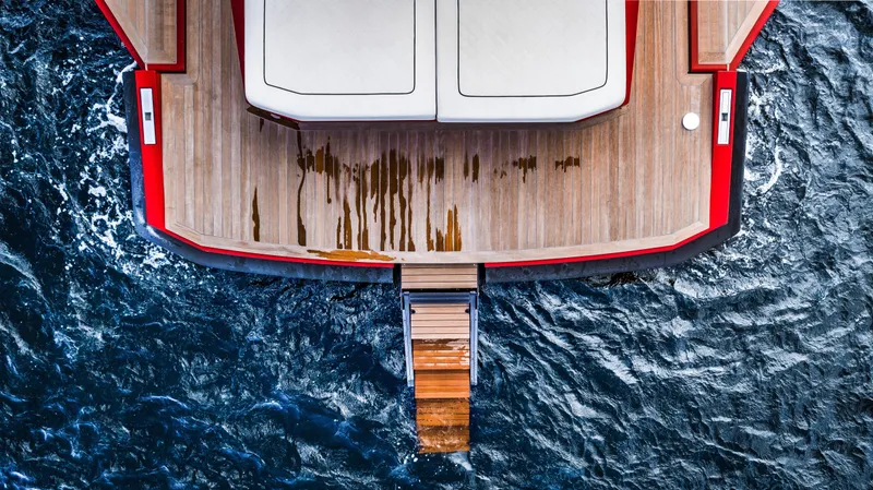 Corso Red Yacht Photos Pics Aerial view of 2021 Wally 48 yacht deck on ocean water.