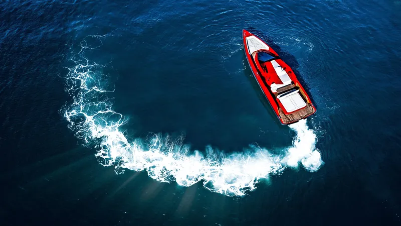 Corso Red Yacht Photos Pics Red Wally 48 yacht making a circular wake in deep blue ocean, 2021 model.