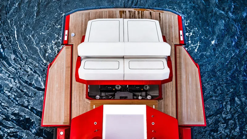 Corso Red Yacht Photos Pics Top view of 2021 Wally 48 yacht with red accents and white seating.