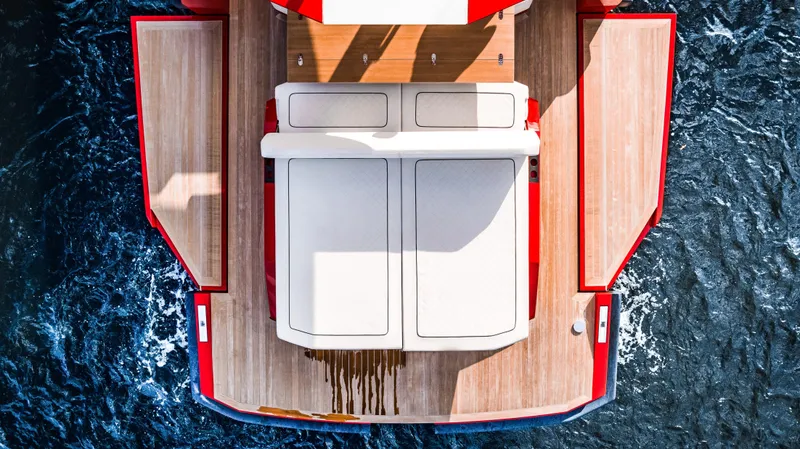 Corso Red Yacht Photos Pics Top view of 2021 Wally 48 yacht with wooden deck and red accents.