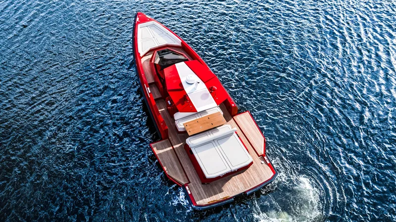 Corso Red Yacht Photos Pics Red 2021 Wally 48 yacht cruising on blue ocean waters, aerial view.