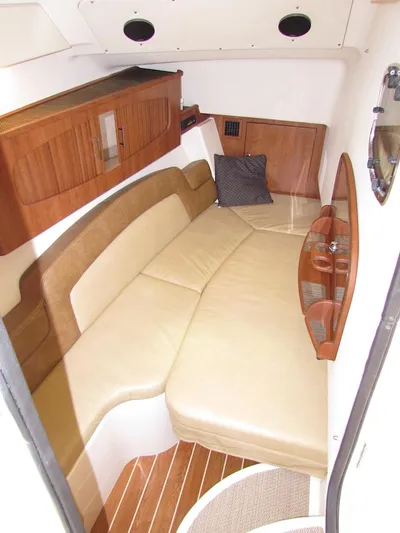  Yacht Photos Pics 2014 Grady-White Freedom 375 cabin interior with beige seating and wooden accents.