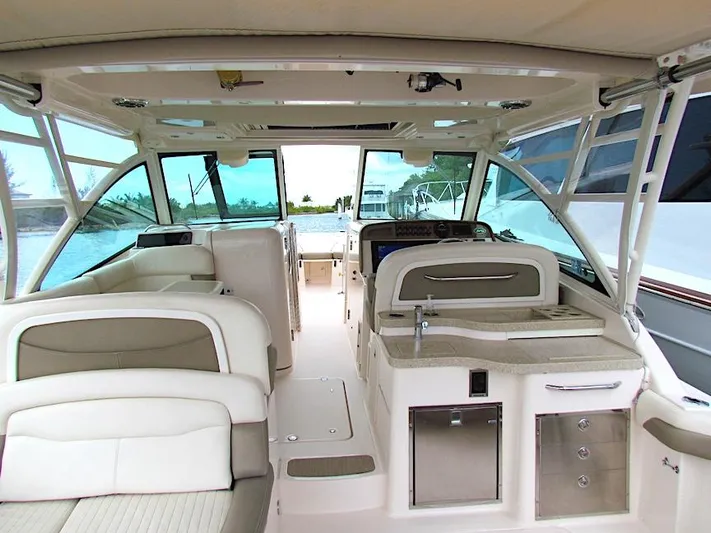  Yacht Photos Pics Interior of 2014 Grady-White Freedom 375 boat with seating and helm station.