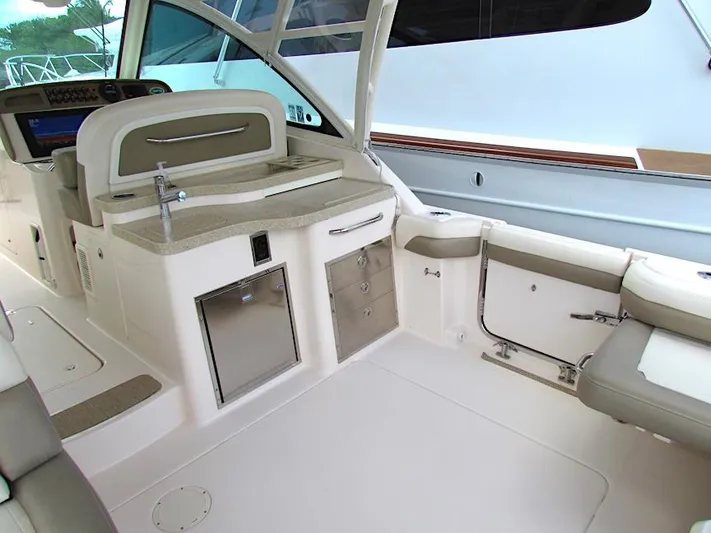  Yacht Photos Pics 2014 Grady-White Freedom 375 boat interior with seating and kitchenette area.