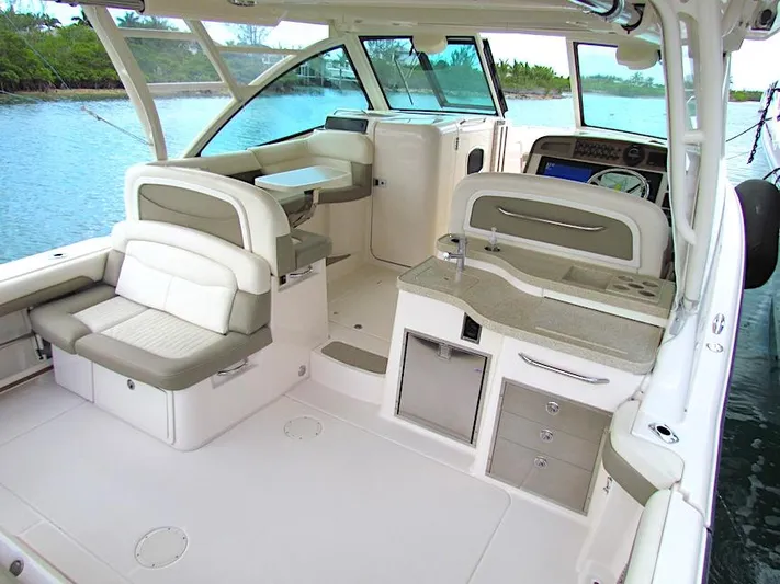  Yacht Photos Pics 2014 Grady-White Freedom 375 boat interior with seating and helm station.