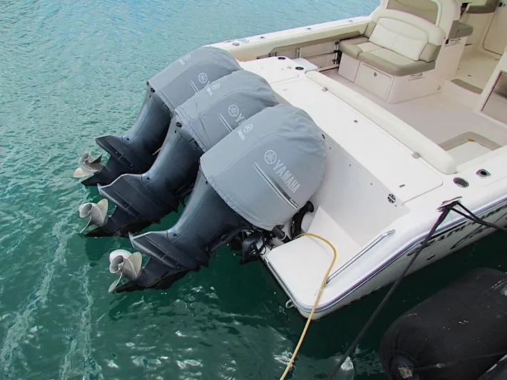  Yacht Photos Pics 2014 Grady-White Freedom 375 boat with triple Yamaha outboard motors in water.