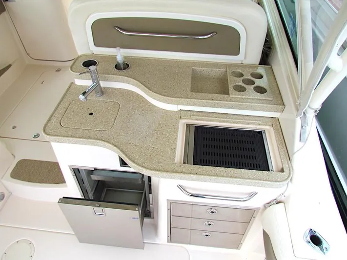  Yacht Photos Pics 2014 Grady-White Freedom 375 boat kitchenette with sink, grill, and storage drawers.