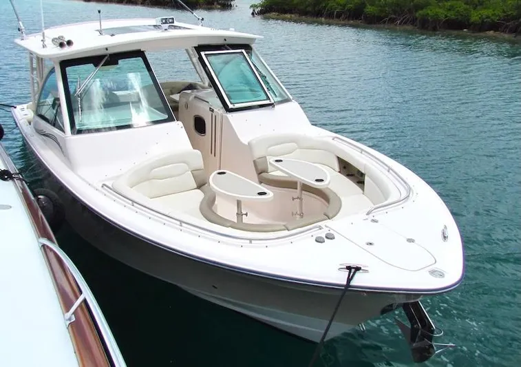  Yacht Photos Pics 2014 Grady-White Freedom 375 boat docked on calm water.