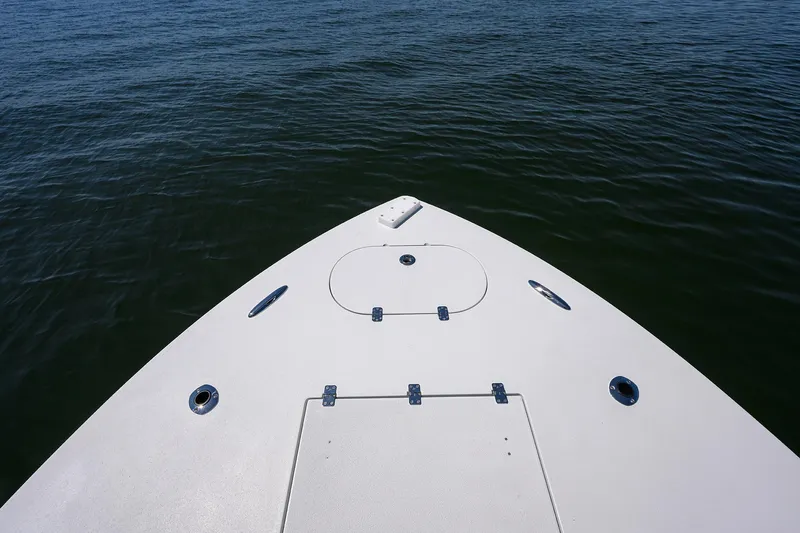  Yacht Photos Pics Bow of 2024 Conch 25 boat on calm water.