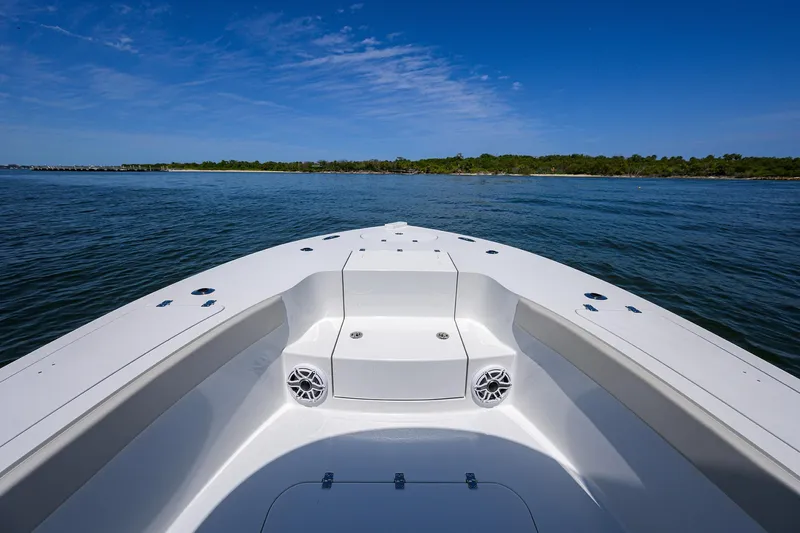  Yacht Photos Pics 2024 Conch 25 boat on calm water with clear blue sky.