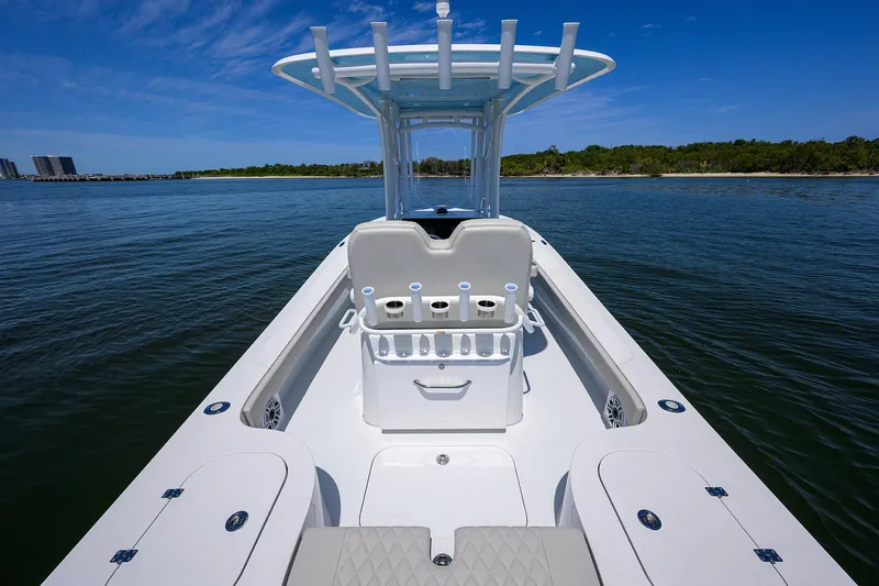  Yacht Photos Pics 2024 Conch 25 boat on calm water with clear blue sky.