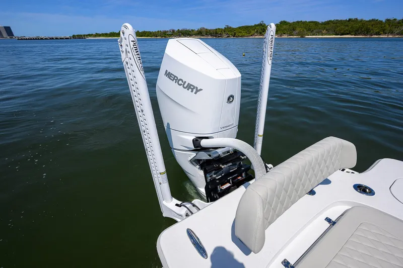 Yacht Photos Pics 2024 Conch 25 boat with Mercury engine on calm water.