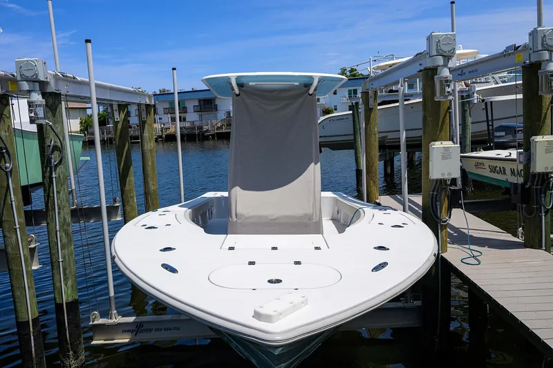  Yacht Photos Pics 2024 Conch 25 boat docked at marina, featuring sleek design and modern amenities.