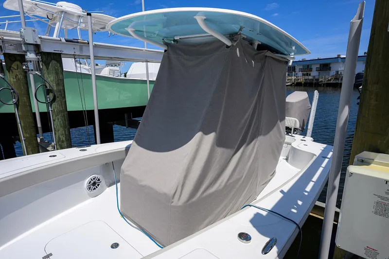  Yacht Photos Pics 2024 Conch 25 boat with covered console docked at marina.