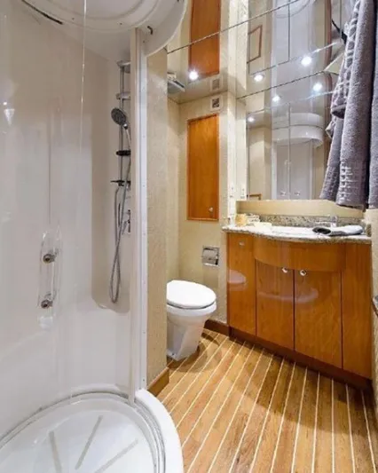  Yacht Photos Pics Luxurious bathroom in 2007 Hatteras 68 Convertible yacht with shower and wooden flooring.