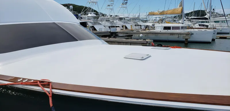  Yacht Photos Pics 2007 Hatteras 68 Convertible yacht docked at a marina.