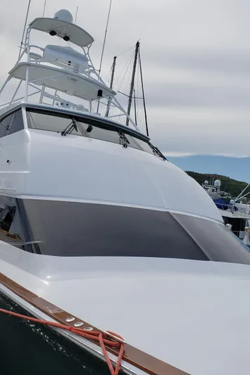  Yacht Photos Pics 2007 Hatteras 68 Convertible yacht docked at marina.