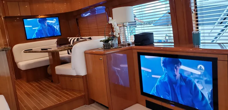  Yacht Photos Pics Luxurious interior of a 2007 Hatteras 68 Convertible yacht with modern amenities.