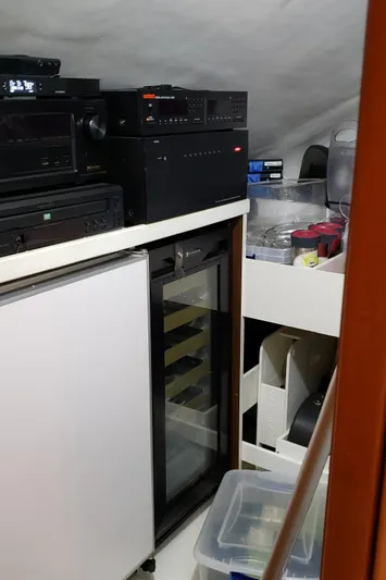  Yacht Photos Pics 2007 Hatteras 68 Convertible yacht interior with electronics and storage area.