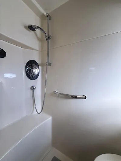 Rogue Yacht Photos Pics Shower area in 2006 Sea Ray 48 Sundancer yacht, featuring modern fixtures and sleek design.