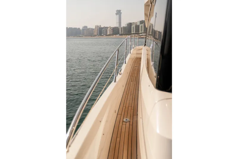 My Serenity Yacht Photos Pics 2018 Sunseeker Manhattan 66 yacht deck with city skyline view.