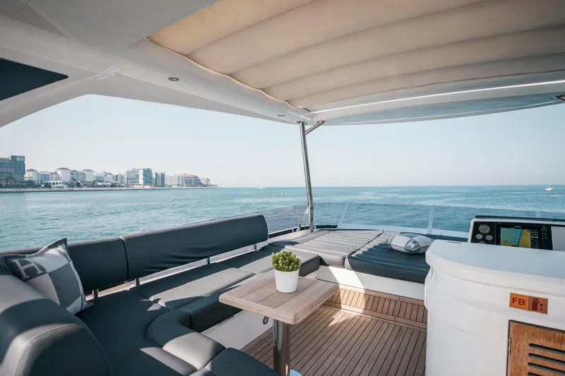 My Serenity Yacht Photos Pics Luxurious 2018 Sunseeker Manhattan 66 yacht interior with ocean view and modern seating.