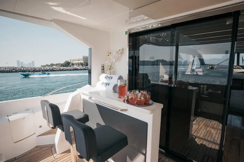 My Serenity Yacht Photos Pics Luxurious 2018 Sunseeker Manhattan 66 yacht interior with ocean view and refreshments.