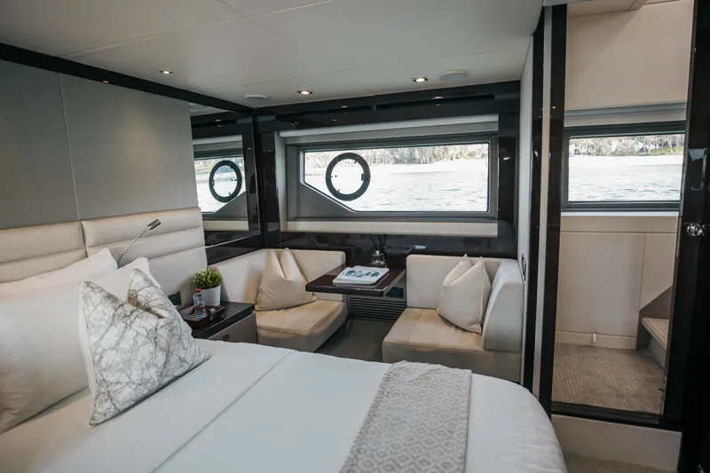 My Serenity Yacht Photos Pics Luxurious interior of 2018 Sunseeker Manhattan 66 yacht with elegant seating and bedding.