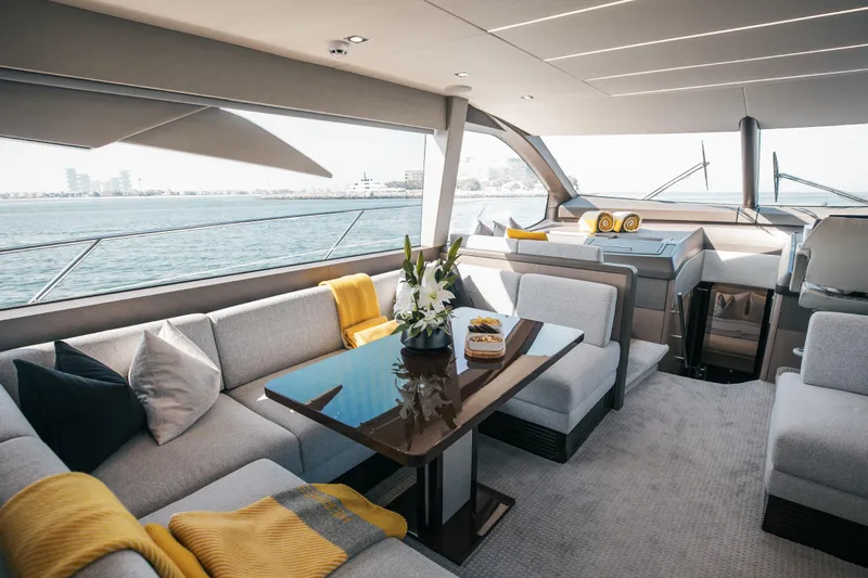 My Serenity Yacht Photos Pics Luxurious interior of 2018 Sunseeker Manhattan 66 yacht with elegant seating and sea view.