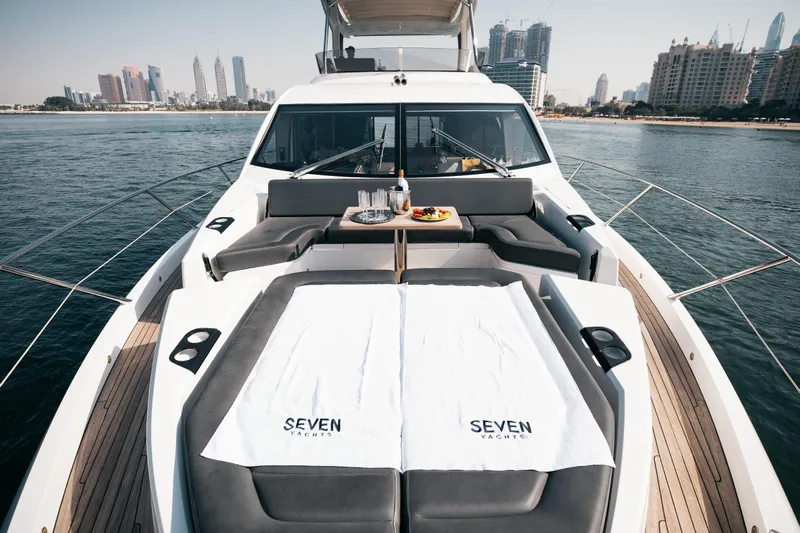 My Serenity Yacht Photos Pics Luxurious 2018 Sunseeker Manhattan 66 yacht with elegant deck and city skyline view.