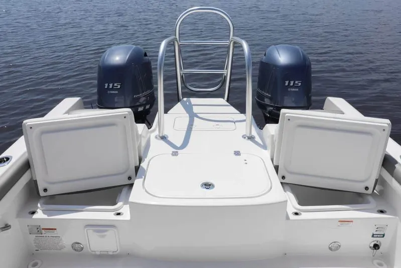 51980 230dc Nap Yacht Photos Pics Manufacturer Provided Image: 2025 World Cat 230 DC boat with dual Yamaha 115 engines on calm water.