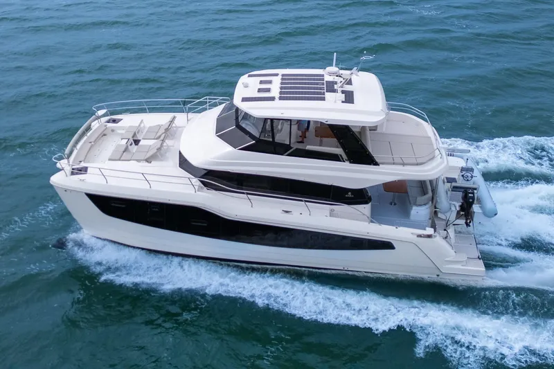  Yacht Photos Pics 2026 Aquila 50 Yacht cruising on open water, showcasing sleek design and luxury features.