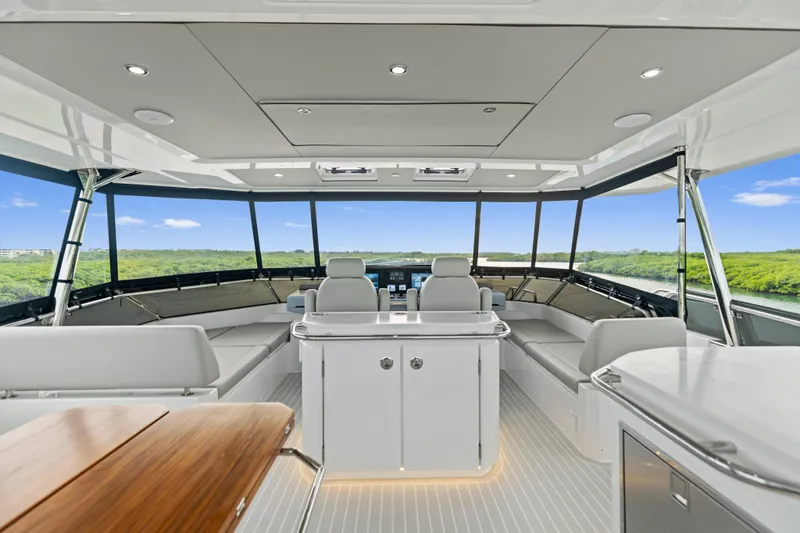  Yacht Photos Pics Luxurious interior of 2026 Aquila 50 Yacht with panoramic windows and modern seating.