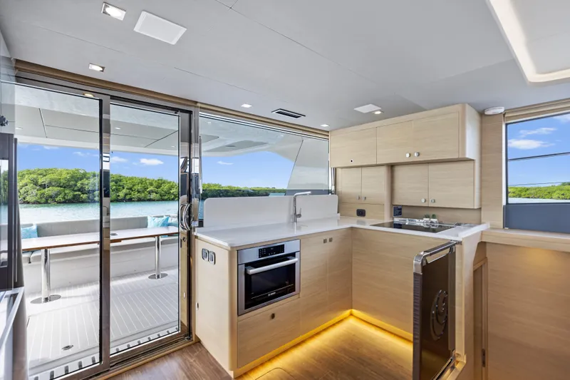  Yacht Photos Pics Modern kitchen interior on 2026 Aquila 50 Yacht with scenic ocean view.