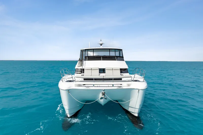  Yacht Photos Pics 2026 Aquila 50 Yacht cruising on clear blue ocean waters.