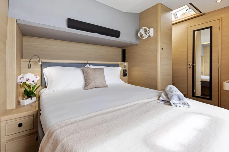  Yacht Photos Pics Luxurious bedroom interior of 2026 Aquila 50 Yacht with modern design and elegant decor.