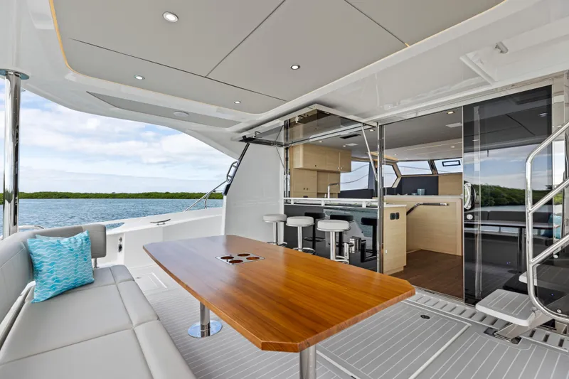  Yacht Photos Pics Luxurious 2026 Aquila 50 Yacht interior with elegant seating and ocean view.