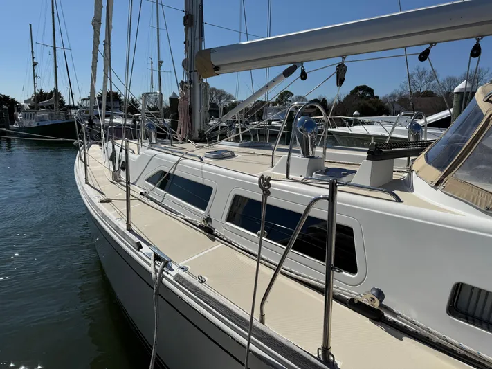Aevitas Yacht Photos Pics Sailboat docked in marina, 2011 Outbound 46 model, sunny day.
