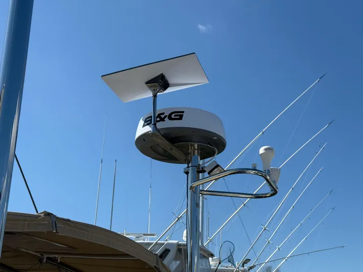 Aevitas Yacht Photos Pics Radar and satellite equipment on 2011 Outbound 46 sailboat against clear blue sky.