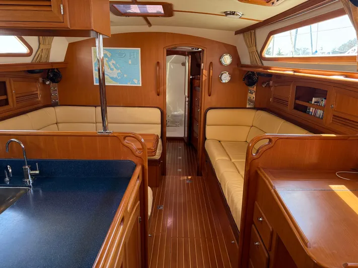 Aevitas Yacht Photos Pics Luxurious interior of 2011 Outbound 46 yacht with wood finish and comfortable seating.