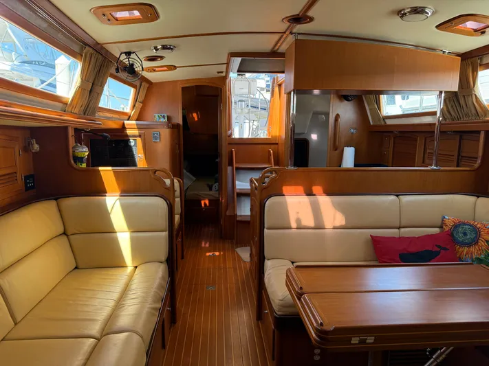 Aevitas Yacht Photos Pics Luxurious interior of 2011 Outbound 46 yacht with wooden finishes and comfortable seating.