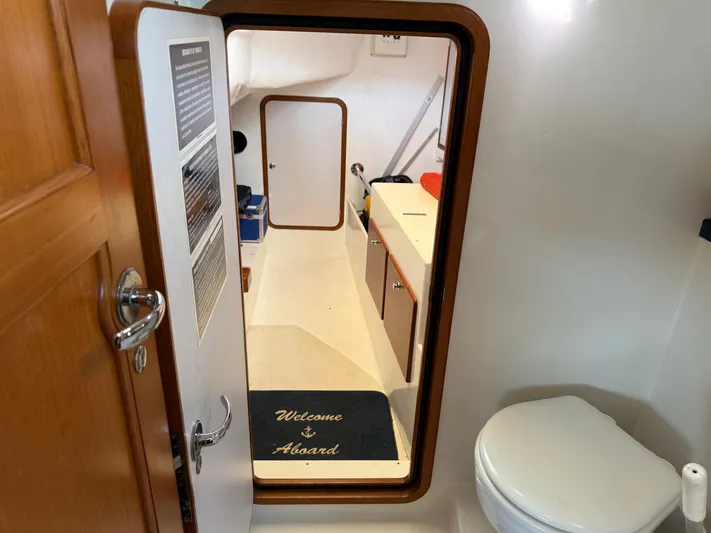 Aevitas Yacht Photos Pics Interior of 2011 Outbound 46 yacht showing bathroom and cabin entrance.