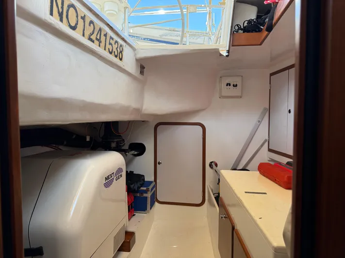 Aevitas Yacht Photos Pics Interior of 2011 Outbound 46 sailboat with equipment and storage compartments.