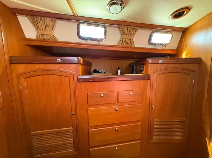 Aevitas Yacht Photos Pics Luxurious wooden interior of 2011 Outbound 46 yacht cabin with storage cabinets.