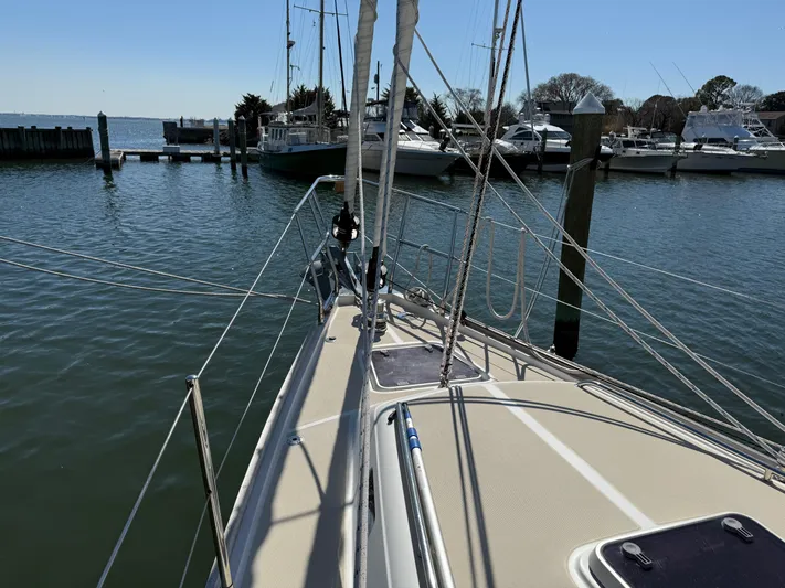 Aevitas Yacht Photos Pics Sailboat docked in marina, Outbound 46 model, 2011, with clear blue sky.