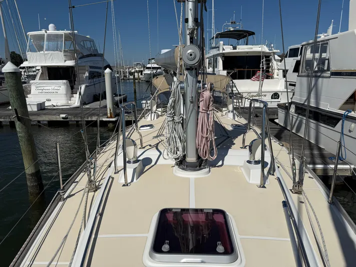 Aevitas Yacht Photos Pics Sailboat deck view, Outbound 46, 2011 model, docked at marina with other yachts.