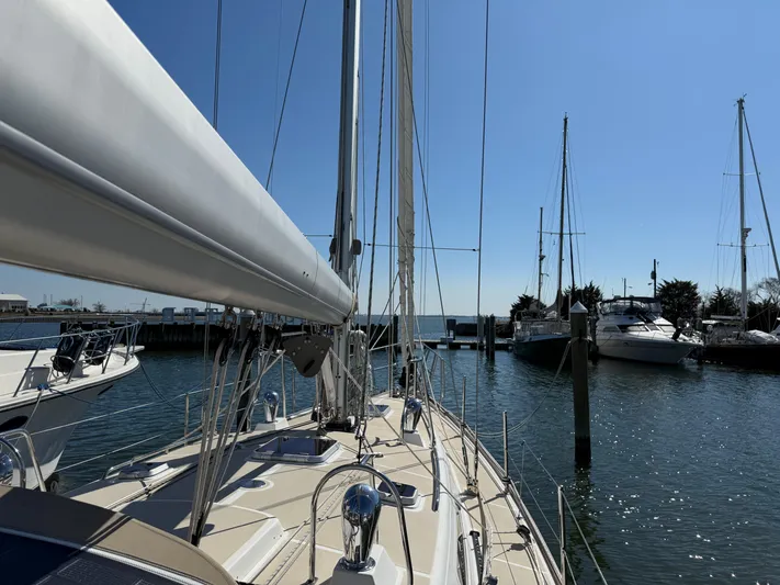 Aevitas Yacht Photos Pics Sailboat docked at marina, Outbound 46 model, 2011, under clear blue sky.