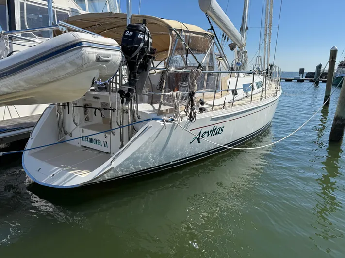 Aevitas Yacht Photos Pics Sailboat docked in marina, 2011 Outbound 46 model, with dinghy and outboard motor.
