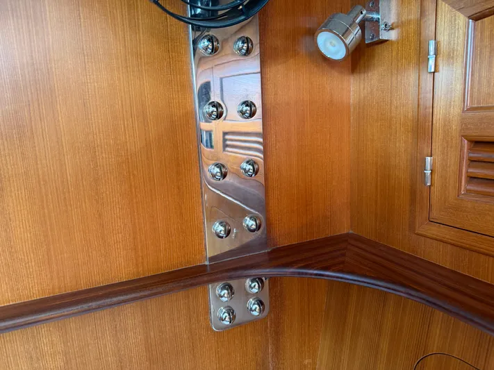 Aevitas Yacht Photos Pics Polished metal fittings on wooden interior of 2011 Outbound 46 yacht.