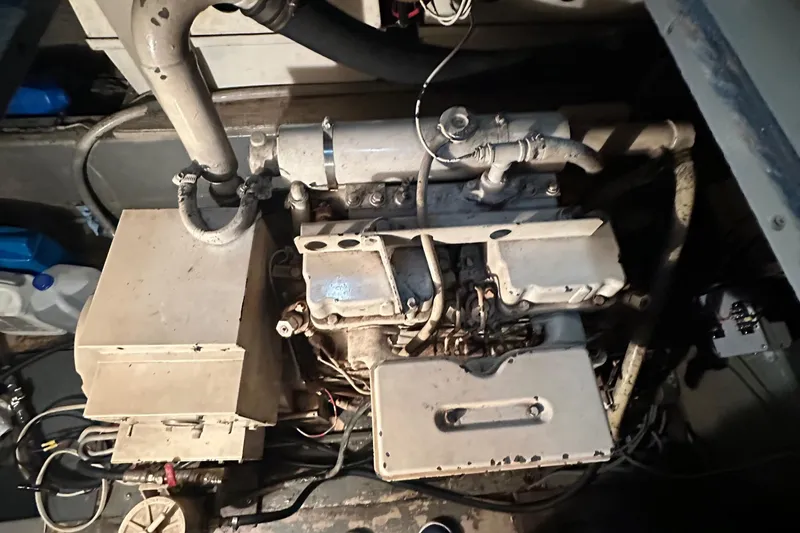 Apple 1 Yacht Photos Pics Engine room of a 1974 Hatteras 58 Yachtfish, showcasing mechanical components.